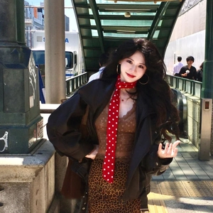 Chic red polka dot silk scarf necklace paired with black leather jacket and leopard skirt
