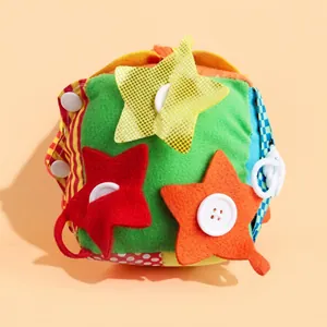 Detailed sensory cloth ball for infants showing colorful fabric patterns and interactive buttons