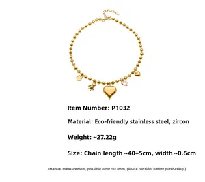 Détails de collier en acier doré avec pendentifs ours et cœur en zircone sur chaîne à billes