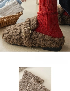 Detailed knit texture of wool slouch socks in red and oatmeal with colorful specks