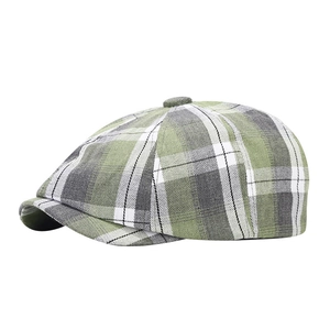 Classico berretto newsboy a quadretti verde e grigio in stile retrò per l'autunno