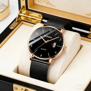 Detail of rose gold quartz watch with black mesh strap and date window in gift box