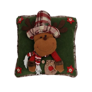 Detail of dark green Christmas pillow with 3D plush reindeer and festive star ornament