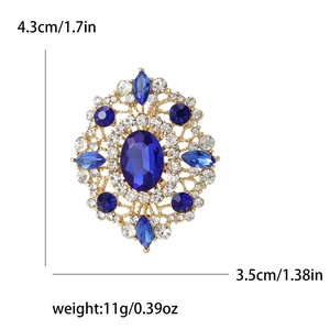 Vintage gold oval blue rhinestone brooch with dimensions 4.3cm and 11g weight info