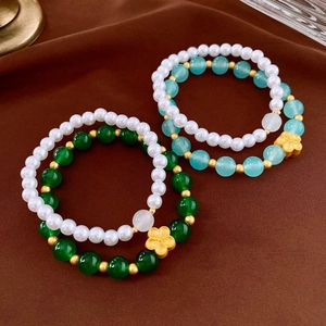 2-piece vintage pearl bracelet set with green and blue glass beads and gold flower charms