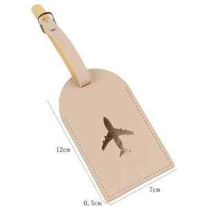 Detailed size specifications of the beige PU leather luggage tag with gold airplane icon