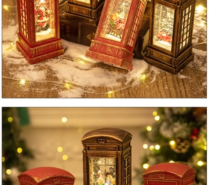 Close-up of vintage Christmas telephone booth lanterns with snowman and warm LED lighting