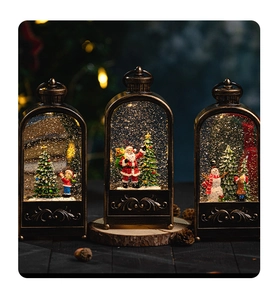 Close-up of bronze Christmas lanterns with glowing snow globe effects and festive figures