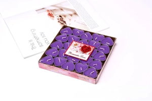 Pack of 50 purple heart-shaped smokeless tea light candles in pink floral packaging
