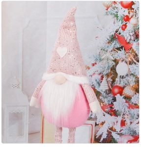 Detail of pink gnome plush with sequin hat and heart decoration for Christmas and Valentine
