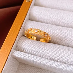 Gold adjustable flower ingot ring with brushed texture and three sparkling zircons