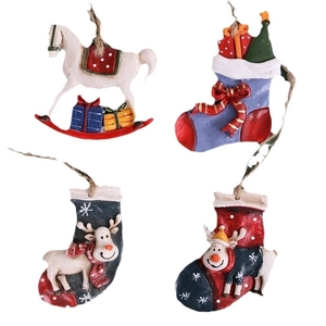 Set of 4 festive resin Christmas ornaments including rocking horse and reindeer socks
