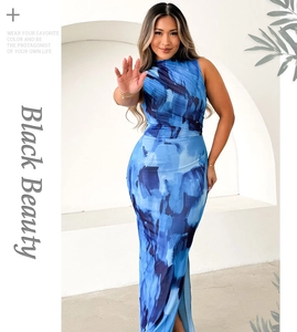 Detail of blue abstract print dress with side slit and elegant slim fit draping