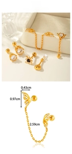 Detailed view of butterfly ear cuff and crown stud earrings set with zircon stones