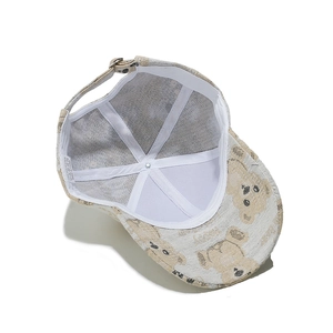 Internal view of beige bear baseball cap with reinforced seams and adjustable metal buckle