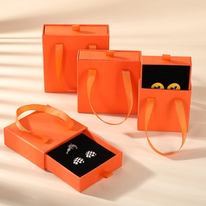 Bright orange drawer jewelry gift box with satin handle and black sponge padding