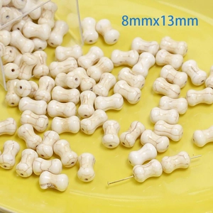 Macro view of bone-shaped white synthetic turquoise beads sized 8mmx13mm for DIY jewelry