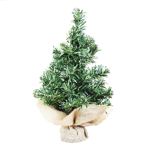 Mini green artificial Christmas tree with burlap wrapped base for tabletop holiday decor