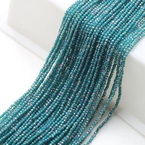 Macro shot of 2mm faceted crystal beads in teal blue for DIY jewelry necklaces