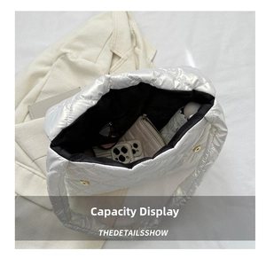 Interior view showing the large capacity and quilted texture of the white tote bag
