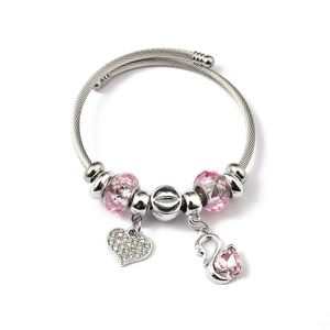 Detail of twisted cable bangle with pink crystal beads and heart swan pendants