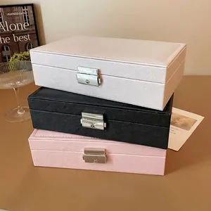 Portable travel jewelry organizer box with security lock and cross pattern texture