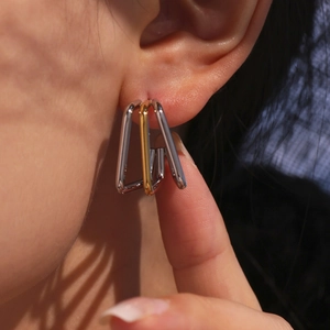 18K gold plated multi-layer stainless steel geometric earrings on a female model