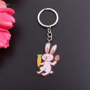 Close-up of pink Easter bunny keychain with carrot and colorful egg details