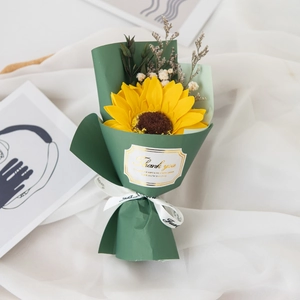 Detail of artificial sunflower bouquet with eucalyptus and thank you greeting cards