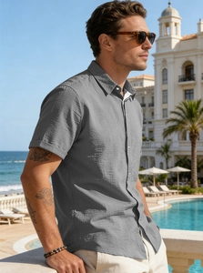 Detail of grey short sleeve button shirt with breathable linen texture and casual collar