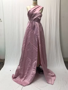 Detail of mauve one-shoulder satin evening dress with pleated bodice and high slit hem