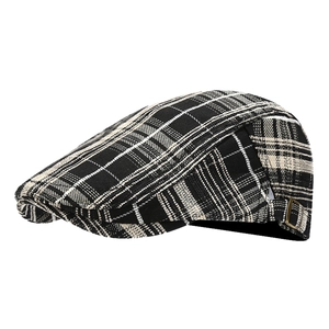 Classic black and white plaid ivy cap with adjustable bronze buckle on white background