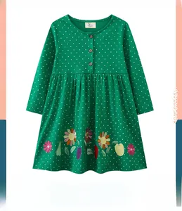 Detail of green long-sleeve girls' dress with polka dots and fruit floral embroidery