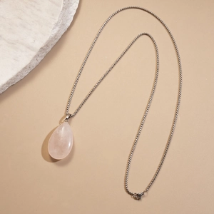 Minimalist long necklace featuring a pink teardrop natural stone pendant on a silver chain