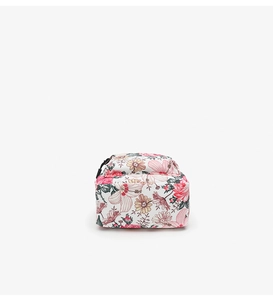 Detail of floral canvas backpack featuring pink hibiscus and yellow daisy patterns