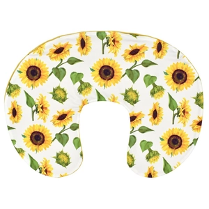 Detail of U-shaped breastfeeding pillow cover with vibrant sunflower print and yellow piping