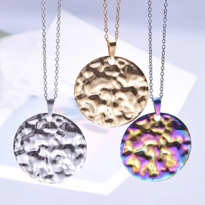 Three round hammered pendant necklaces in silver, gold, and rainbow 18k plated steel