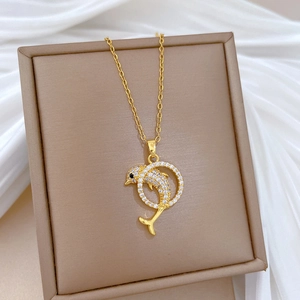 Elegant titanium steel necklace featuring a crystal-encrusted dolphin jumping through a ring