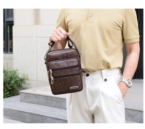 Brown PU leather messenger bag with multiple zipper pockets shown in outdoor lifestyle setting