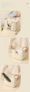Detail view of cream canvas lunch bag with side pockets for cutlery and lunch boxes