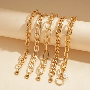 5-piece gold-tone layered chain bracelets set with faux pearl details and OT clasp