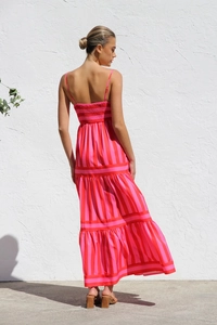 Detail of pink and red striped backless tiered dress with elastic smocking details