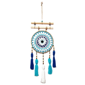 Handmade Evil Eye dream catcher wall hanging with blue cotton tassels and wooden beads