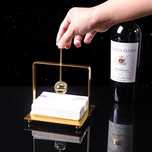 Nordic gold stainless steel napkin holder with weighted arm for modern dining table decor