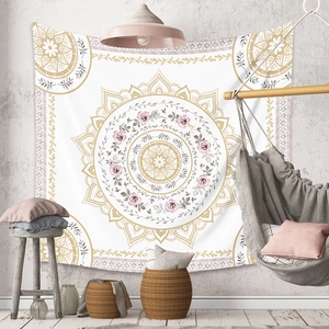 Detailed view of bohemian mandala tapestry hanging on a textured grey wall decor