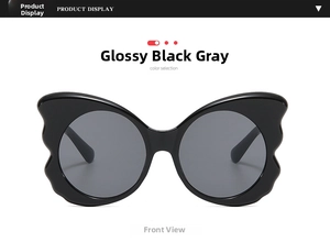 Front view of stylish butterfly oversized sunglasses with black frame and grey lenses
