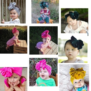 Soft velvet baby headbands with large bows in various colors for infants and toddlers