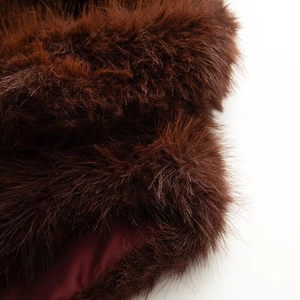 Detail of soft faux fur texture with dark brown plush and smooth satin lining