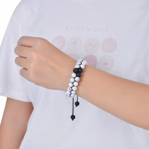 Close-up of adjustable double-layer beaded bracelet with white turquoise and lava stones