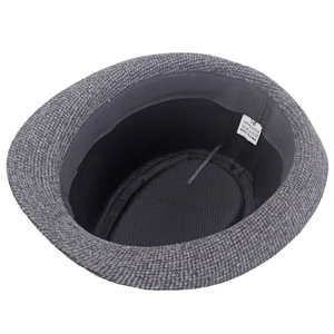 Detail of dark grey fedora hat interior with 100% polyester label and sweatband